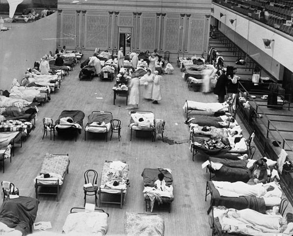 American Red Cross nurses tend to flu patients in temporary wards set up inside Oakland Municipal Auditorium, 1918.
Wikipedia